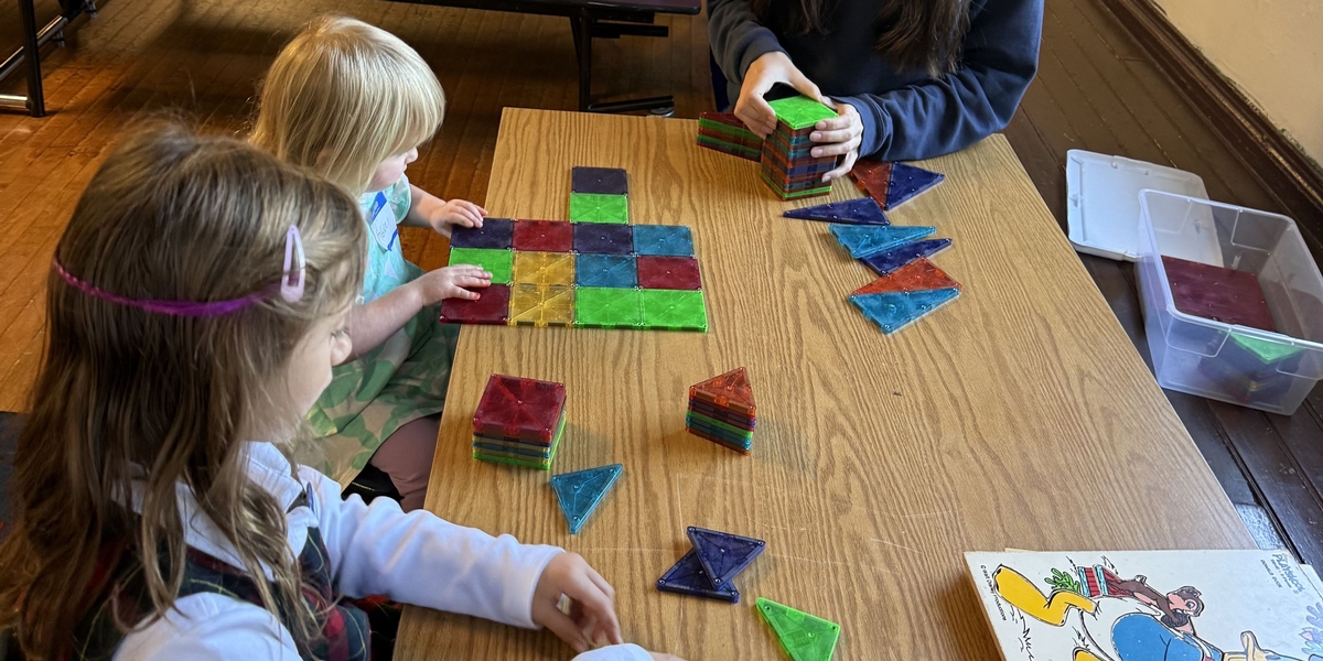 Students meet prospective families during an NCA play date